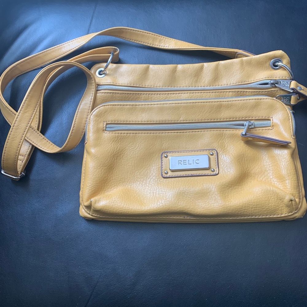 Relic crossbody bag in sunshine yellow. 4 zipper compartments. 6 ca…